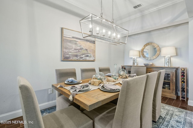 244 Caribbean Pl, Saint Johns, FL 32259 - dining space featuring a chandelier, crown molding, wood finished floors, and baseboards