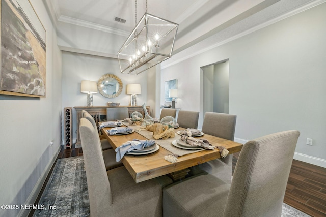 244 Caribbean Pl, Saint Johns, FL 32259 - dining area with a chandelier, ornamental molding, wood finished floors, and baseboards