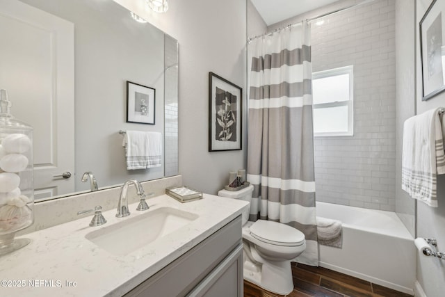 244 Caribbean Pl, Saint Johns, FL 32259 - full bathroom featuring vanity, wood finished floors, toilet, and shower / tub combo