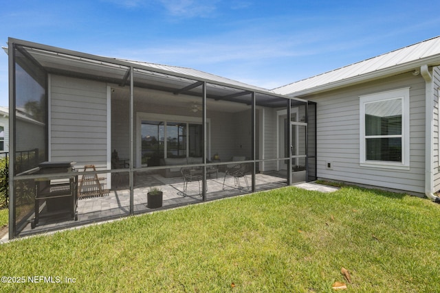 244 Caribbean Pl, Saint Johns, FL 32259 - rear view of property featuring a patio area, a yard, metal roof, and glass enclosure