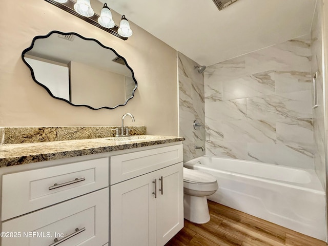 7779 Las Palmas Way Unit 114, Jacksonville, FL 32256 - bathroom featuring toilet, shower / washtub combination, vanity, and wood finished floors