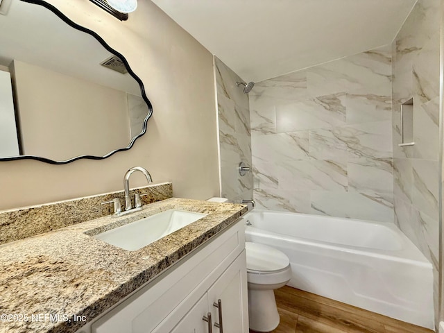 7779 Las Palmas Way Unit 114, Jacksonville, FL 32256 - full bath featuring toilet, bathing tub / shower combination, vanity, and wood finished floors