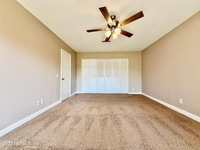 7779 Las Palmas Way Unit 114, Jacksonville, FL 32256 - unfurnished bedroom with baseboards, carpet, a closet, and ceiling fan