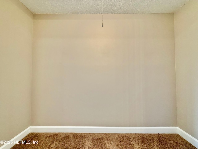 7779 Las Palmas Way Unit 114, Jacksonville, FL 32256 - carpeted empty room featuring baseboards and a textured ceiling