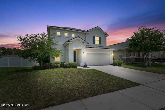 1011 Wetland Ridge Cir, Middleburg, FL 32068 - traditional-style house with stucco siding, a garage, and concrete driveway