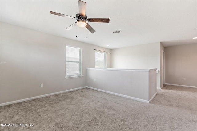 1011 Wetland Ridge Cir, Middleburg, FL 32068 - empty room featuring carpet flooring, baseboards, and a ceiling fan