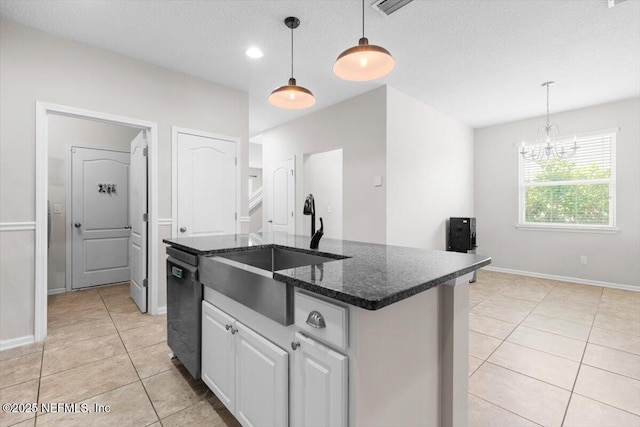 1011 Wetland Ridge Cir, Middleburg, FL 32068 - kitchen featuring a sink, light tile patterned floors, a chandelier, dishwasher, and a kitchen island with sink