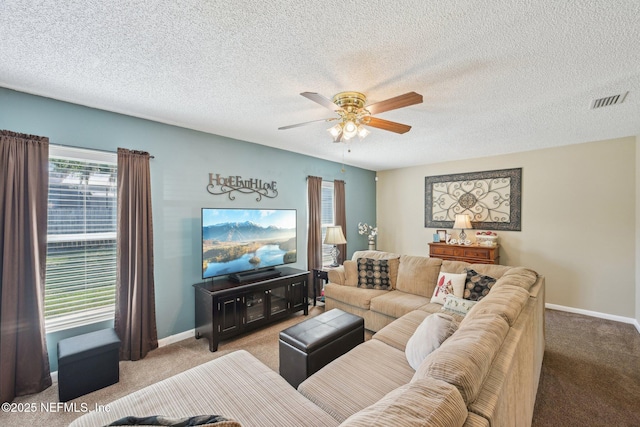 1515 Husson Ave, Palatka, FL 32177 - carpeted living area with ceiling fan, baseboards, and a textured ceiling