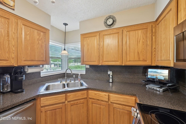 1515 Husson Ave, Palatka, FL 32177 - kitchen featuring a sink, stainless steel appliances, dark countertops, tasteful backsplash, and a textured ceiling