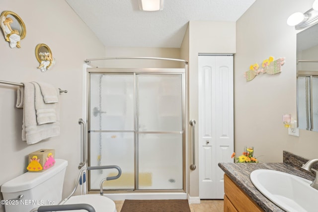 1515 Husson Ave, Palatka, FL 32177 - full bath featuring a stall shower, toilet, vanity, tile patterned flooring, and a textured ceiling