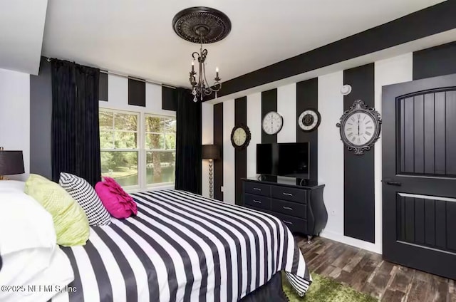 945 Registry Blvd Unit 207, Saint Augustine, FL 32092 - bedroom featuring a chandelier, dark wood-style floors, and baseboards