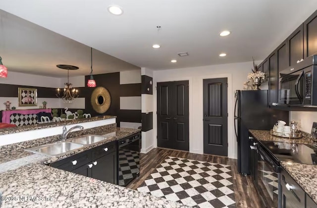 945 Registry Blvd Unit 207, Saint Augustine, FL 32092 - kitchen featuring black appliances, a sink, light stone countertops, recessed lighting, and a chandelier