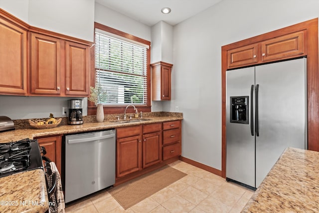 1819 Landon Ave, Jacksonville, FL 32207 - kitchen featuring appliances with stainless steel finishes, brown cabinetry, light tile patterned floors, and recessed lighting