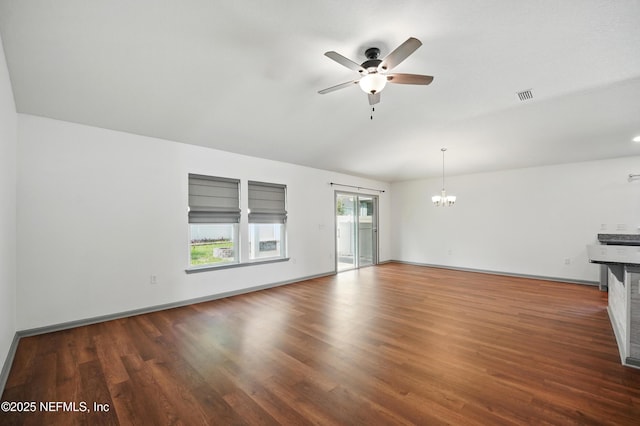 12372 Golden Bell Dr, Jacksonville, FL 32225 - unfurnished living room with ceiling fan, a chandelier, wood finished floors, and baseboards