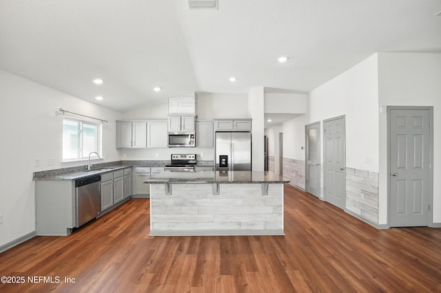 12372 Golden Bell Dr, Jacksonville, FL 32225 - kitchen with stainless steel appliances, gray cabinetry, a sink, lofted ceiling, and dark wood-style flooring
