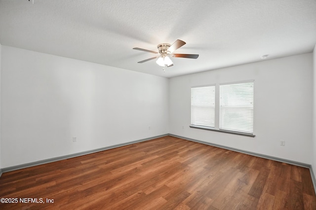 12372 Golden Bell Dr, Jacksonville, FL 32225 - spare room with wood finished floors, a ceiling fan, and baseboards