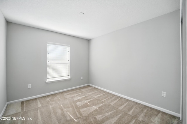 12372 Golden Bell Dr, Jacksonville, FL 32225 - carpeted spare room featuring baseboards
