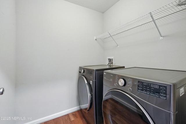 12372 Golden Bell Dr, Jacksonville, FL 32225 - washroom featuring separate washer and dryer, wood finished floors, and baseboards