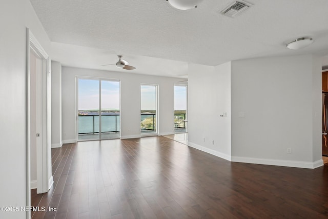 1431 Riverplace Blvd Unit 1707, Jacksonville, FL 32207 - unfurnished room featuring ceiling fan, dark wood finished floors, and baseboards