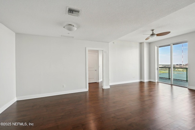 1431 Riverplace Blvd Unit 1707, Jacksonville, FL 32207 - empty room featuring a ceiling fan, wood finished floors, baseboards, and a textured ceiling