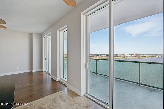 1431 Riverplace Blvd Unit 1707, Jacksonville, FL 32207 - spare room featuring a ceiling fan, wood finished floors, and baseboards