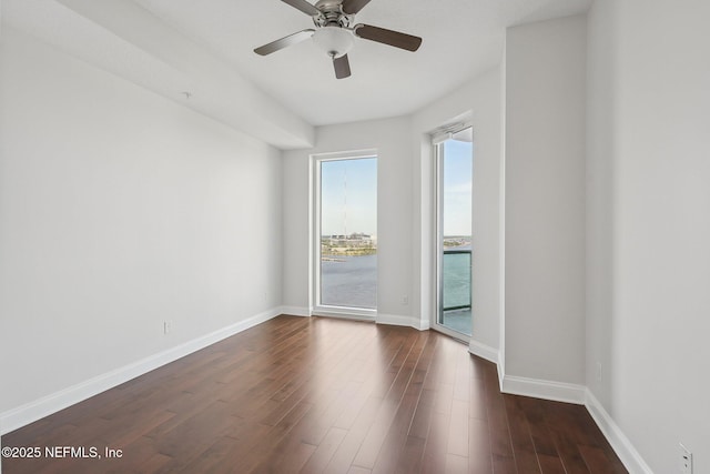 1431 Riverplace Blvd Unit 1707, Jacksonville, FL 32207 - unfurnished room with baseboards, dark wood finished floors, and ceiling fan
