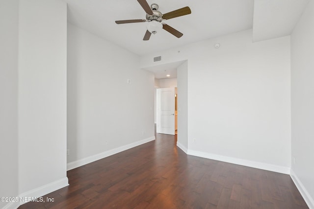1431 Riverplace Blvd Unit 1707, Jacksonville, FL 32207 - spare room featuring dark wood finished floors, baseboards, and a ceiling fan