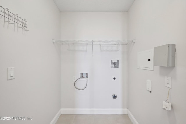 1431 Riverplace Blvd Unit 1707, Jacksonville, FL 32207 - laundry area with hookup for an electric dryer, washer hookup, baseboards, and light tile patterned flooring