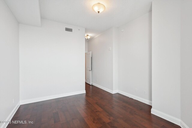 1431 Riverplace Blvd Unit 1707, Jacksonville, FL 32207 - empty room with dark wood-style floors and baseboards