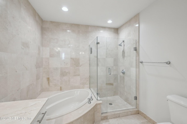 1431 Riverplace Blvd Unit 1707, Jacksonville, FL 32207 - full bath with a garden tub, a shower stall, recessed lighting, toilet, and tile patterned floors