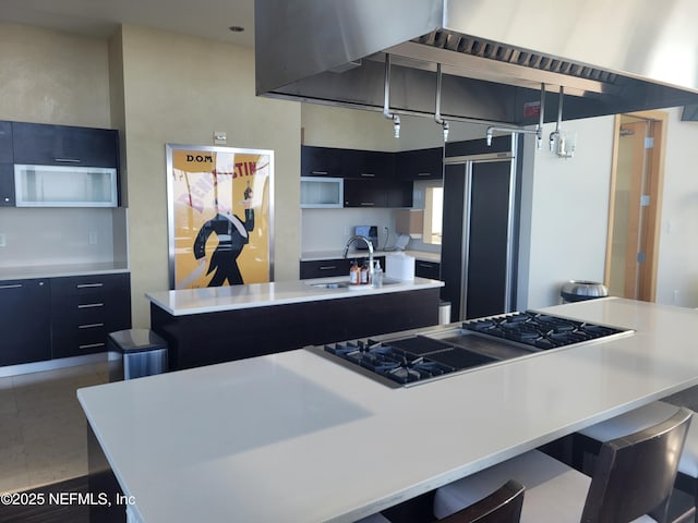 1431 Riverplace Blvd Unit 1707, Jacksonville, FL 32207 - kitchen featuring a sink, a kitchen island with sink, stainless steel gas cooktop, light countertops, and modern cabinets