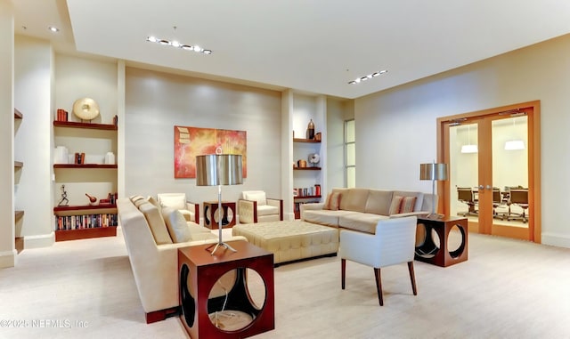 1431 Riverplace Blvd Unit 1707, Jacksonville, FL 32207 - living area with built in shelves, french doors, and baseboards