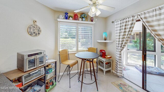 21 Mid Pines Cir, Palm Coast, FL 32137 - dining area featuring ceiling fan, light tile patterned flooring, and baseboards