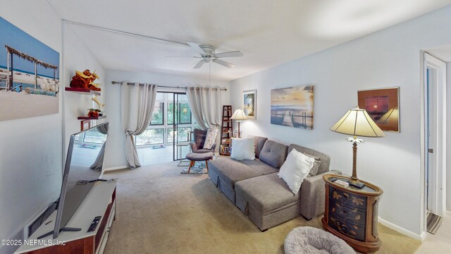 21 Mid Pines Cir, Palm Coast, FL 32137 - living room with a ceiling fan, carpet flooring, and baseboards