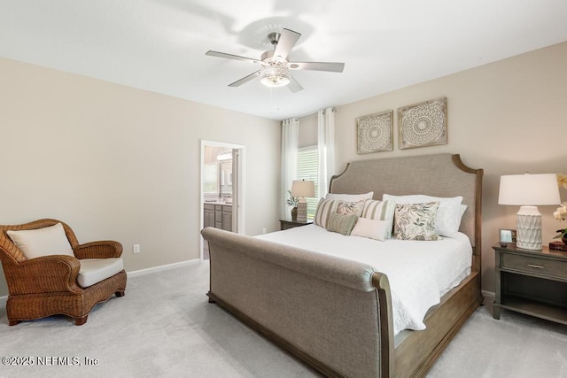 488 Montserrat Dr, Saint Augustine, FL 32092 - bedroom with light colored carpet, ensuite bathroom, a ceiling fan, and baseboards