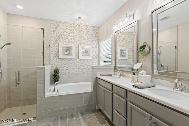 488 Montserrat Dr, Saint Augustine, FL 32092 - bathroom with a stall shower, a garden tub, double vanity, and a chandelier