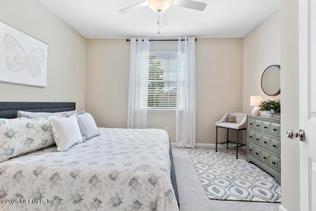 488 Montserrat Dr, Saint Augustine, FL 32092 - bedroom featuring light colored carpet, baseboards, and a ceiling fan