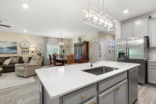 488 Montserrat Dr, Saint Augustine, FL 32092 - kitchen with gray cabinetry, a sink, appliances with stainless steel finishes, and recessed lighting