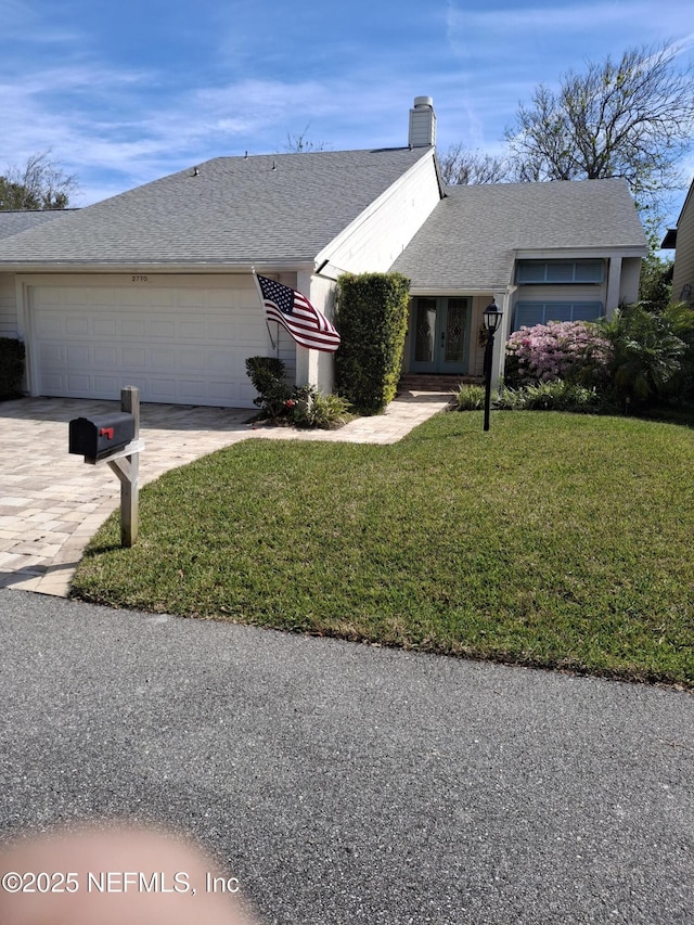 2770 Bordeaux Ct, Ponte Vedra Beach, FL 32082 - ranch-style home featuring an attached garage, a front yard, french doors, driveway, and roof with shingles