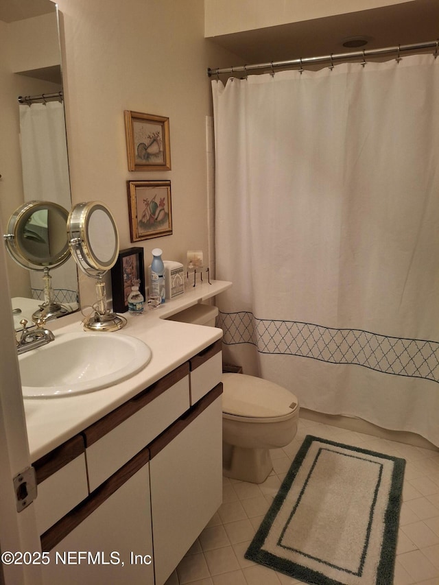 2770 Bordeaux Ct, Ponte Vedra Beach, FL 32082 - bathroom featuring toilet, vanity, tile patterned flooring, and a shower with shower curtain