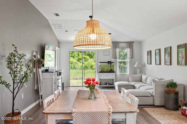 12097 Grand Herring Way, Jacksonville, FL 32219 - dining area featuring wood finished floors and vaulted ceiling
