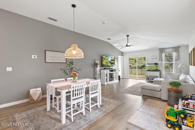 12097 Grand Herring Way, Jacksonville, FL 32219 - dining space featuring ceiling fan, wood finished floors, lofted ceiling, and baseboards