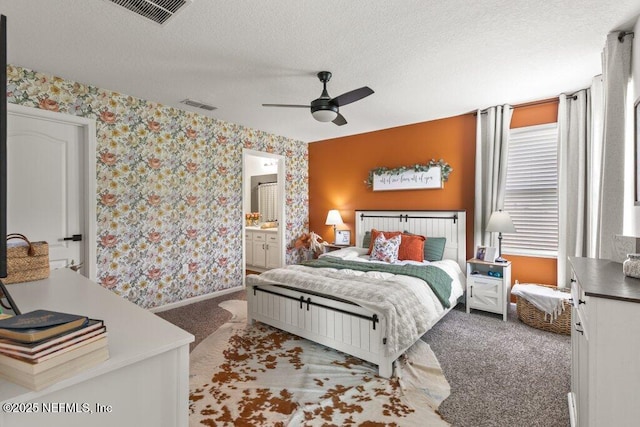 12097 Grand Herring Way, Jacksonville, FL 32219 - carpeted bedroom featuring wallpapered walls, a textured ceiling, baseboards, ceiling fan, and ensuite bath