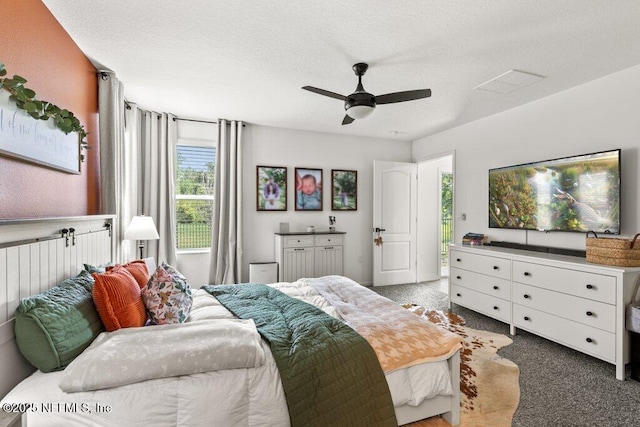 12097 Grand Herring Way, Jacksonville, FL 32219 - carpeted bedroom with a textured ceiling and ceiling fan