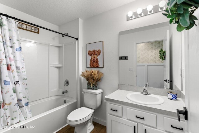 12097 Grand Herring Way, Jacksonville, FL 32219 - full bath featuring shower / bath combination with curtain, a textured ceiling, vanity, toilet, and wood finished floors