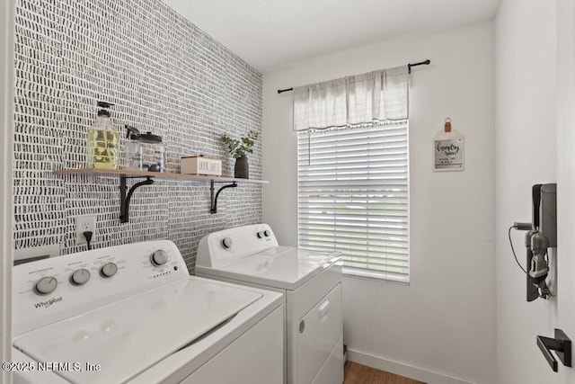 12097 Grand Herring Way, Jacksonville, FL 32219 - laundry room featuring separate washer and dryer, plenty of natural light, and baseboards