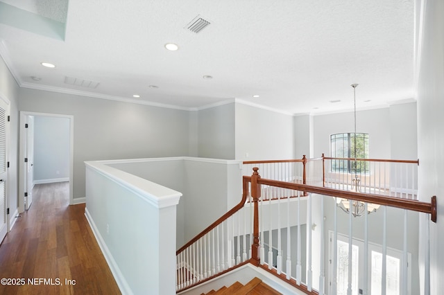 10065 Ecton Ln, Jacksonville, FL 32246 - hall featuring an upstairs landing, a chandelier, recessed lighting, wood finished floors, and baseboards