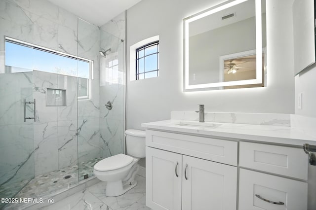 10065 Ecton Ln, Jacksonville, FL 32246 - full bathroom with a marble finish shower, marble finish floors, and toilet