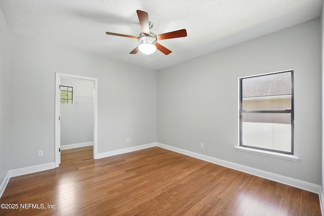 10065 Ecton Ln, Jacksonville, FL 32246 - unfurnished room featuring ceiling fan, wood finished floors, baseboards, and a textured ceiling