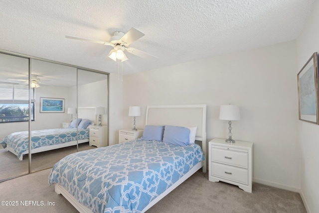 3360 Ocean Shore Blvd Unit 3070, Ormond Beach, FL 32176 - bedroom with carpet, a closet, a textured ceiling, and a ceiling fan